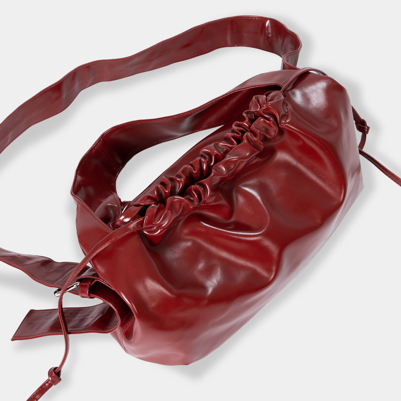 ARYA Red Drawstring Crossbody Bag ASTOUD
