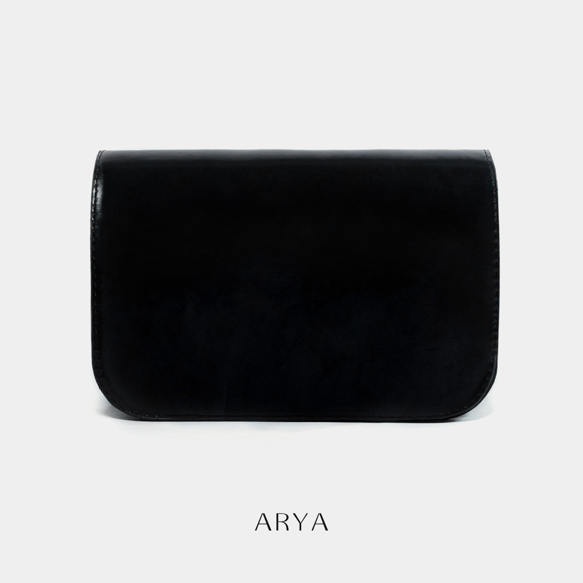 BLACK DAILY FLAP BAG by ARYA in synthetic microfiber leather, dimensions 8.66 x 5.51 x 3.15 inches, available at ASTOUD.