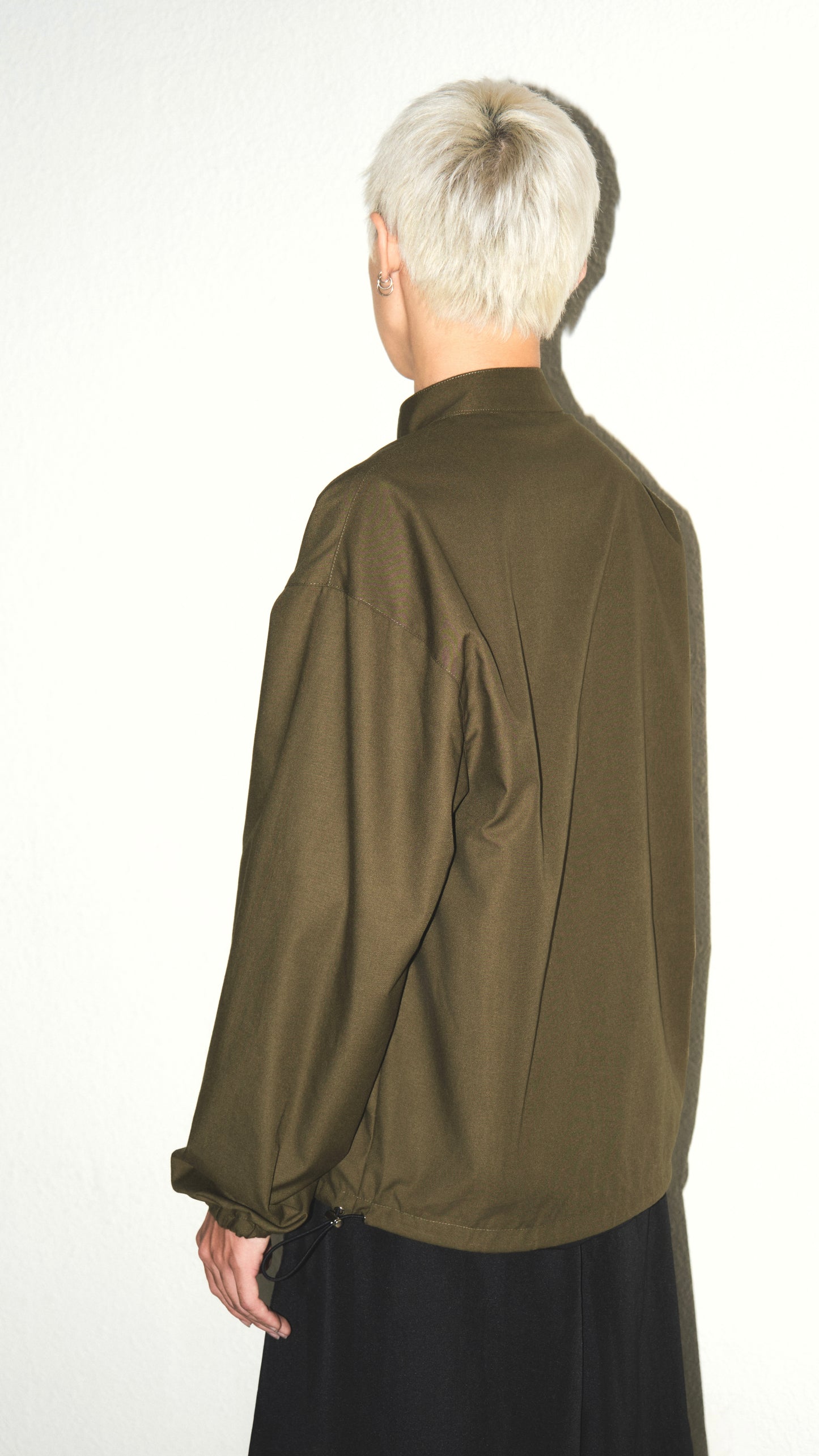 olive-buttoned-jacket the idiot astoud