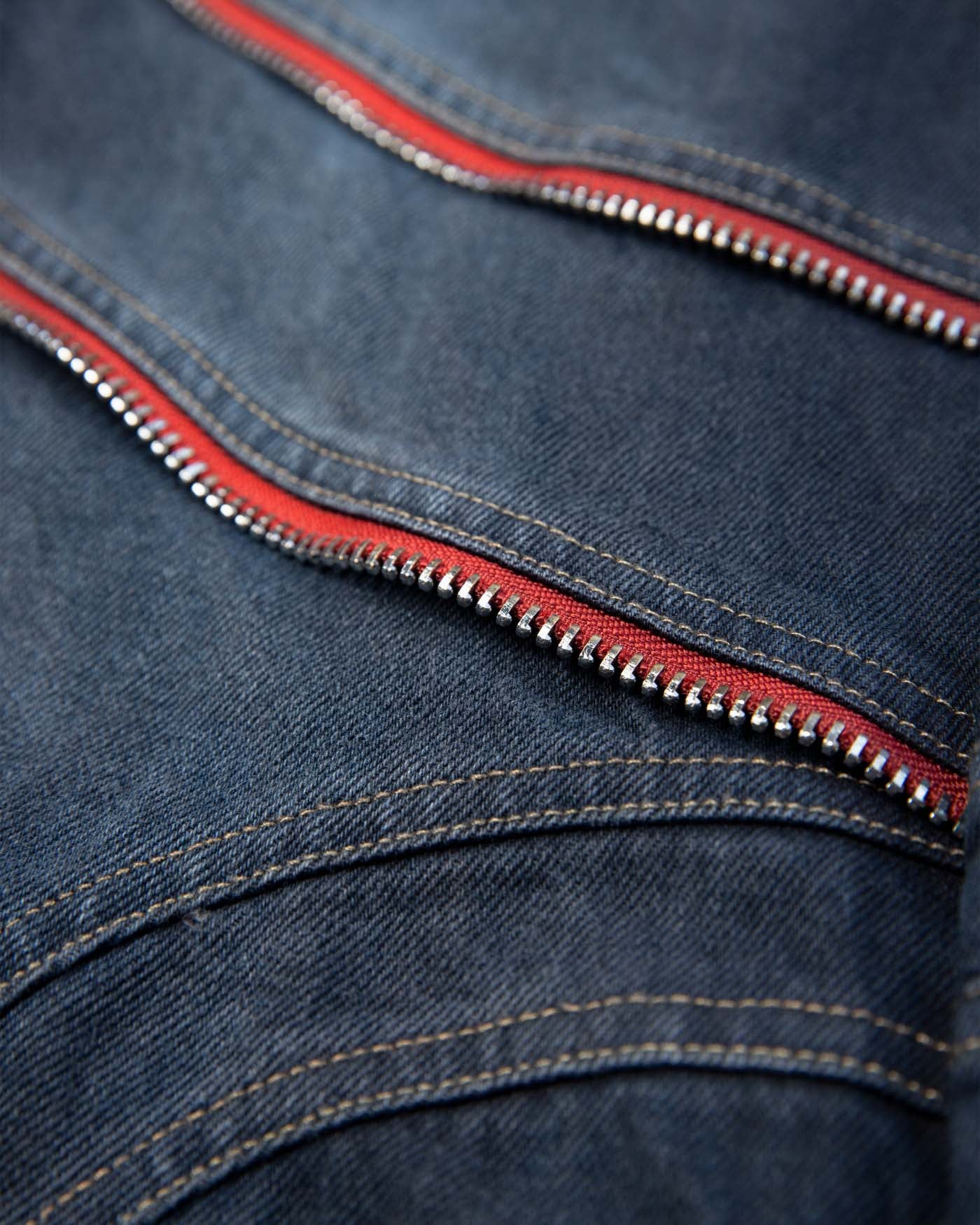 WAVE Washed Red Zipped Pants with decorative zippers and flared legs